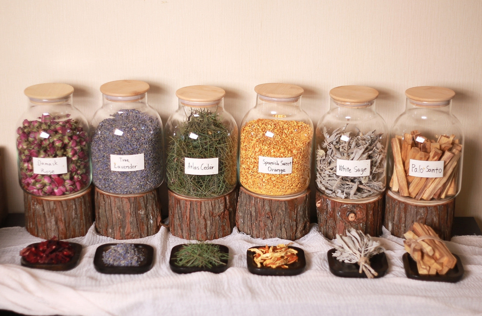 Banner with natural ingredients and containers used for incense sticks, reflecting Shu Incense's handcrafted tradition