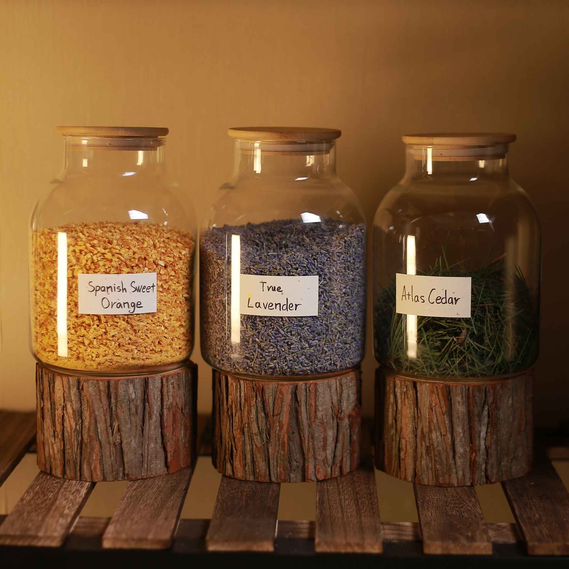 Glass jars filled with three types of natural incense materials