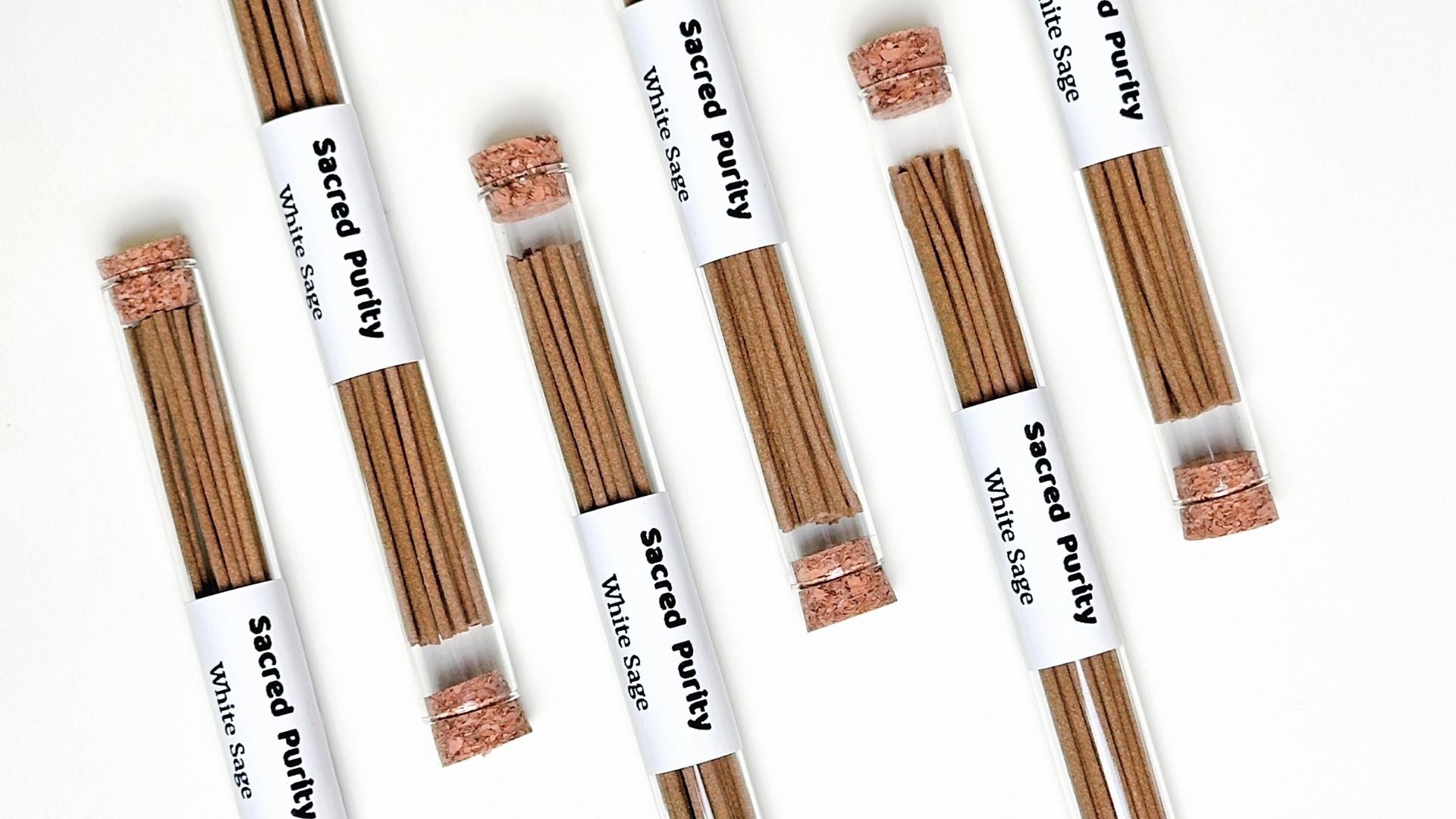 Six tubes of incense sticks arranged in a clean and minimal product display